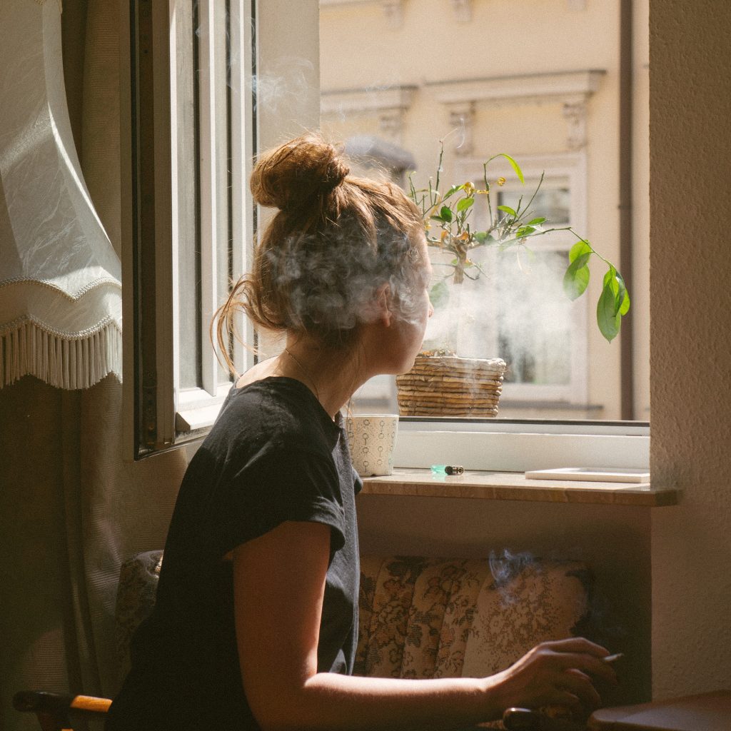 Girl smoking inside - How to get the smoke smell out of a house